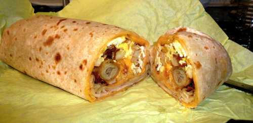 The Brian Burrito A beef taquito wrapped in a breakfast burrito filled with eggs, cheese, fries, and then wrapped in a giant quesadilla. Served with hot sauce and sour cream. (Submitted by Britta Hoskins via yelp)